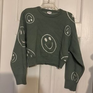 Green smiley face crew neck cropped sweater